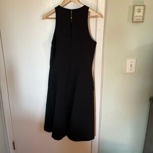 Banana Republic sleeveless black dress. Size 8. Narrow waist. Wide skirt.